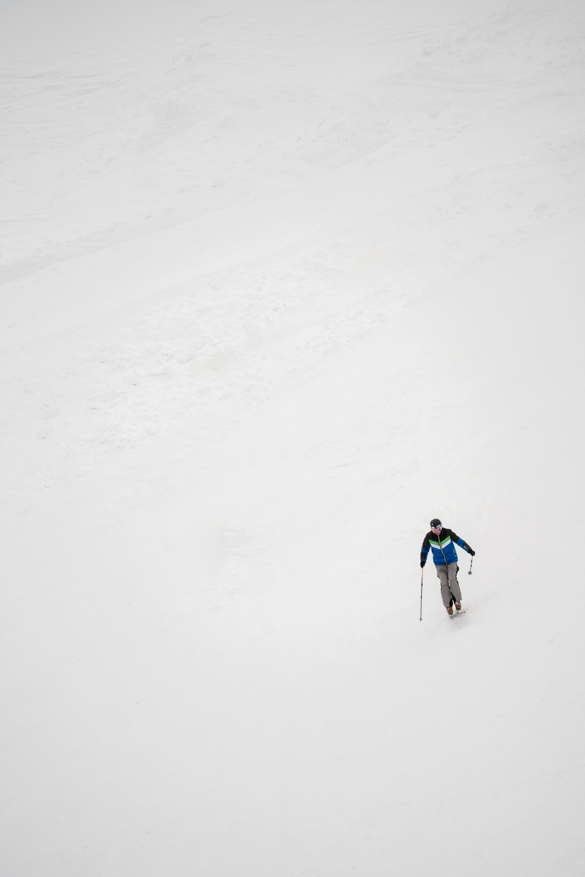 Skier descending the snowy slopes of the Polish Tatra Mountains